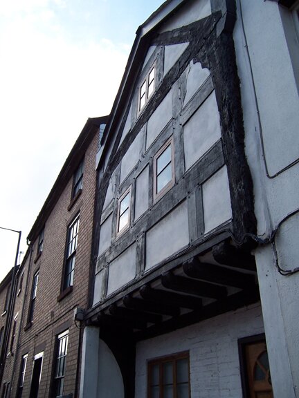 Detail of an overhang from a black and white building in Leominster, Herefordshire
